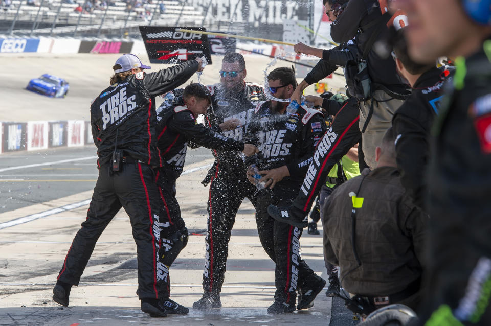 Josh Berry's team celebrate in their pit box after winning the NASCAR Xfinity Series auto race at Dover International Speedway, Saturday, April 30, 2022, in Dover, Del. (AP Photo/Jason Minto)