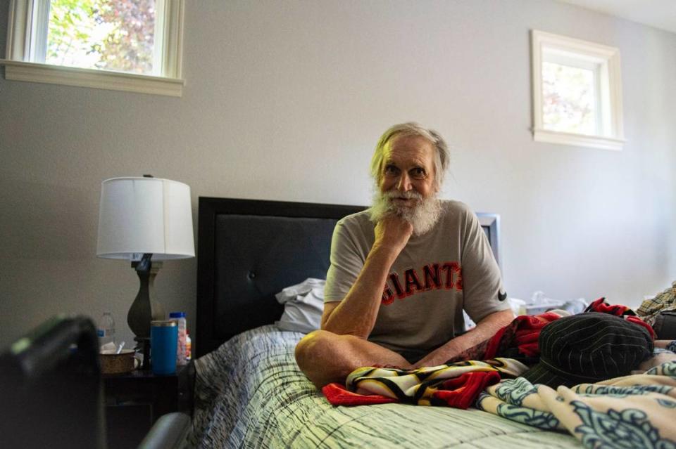 Robert Borden sits in his bedroom at a permanent supportive home in Rocklin on Friday, July 24, 2020, run by The Gathering Inn, a housing first non-profit working to end homelessness in Placer County. Borden came to the program after years being unhoused and bouncing between shelters.