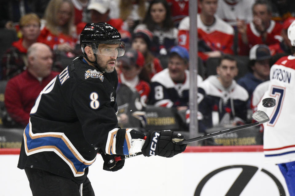 Washington Capitals left wing Alex Ovechkin (8) juggles the puck during a break in the action in the second period of an NHL hockey game against the Montreal Canadiens, Saturday, Dec. 31, 2022, in Washington. (AP Photo/Nick Wass)