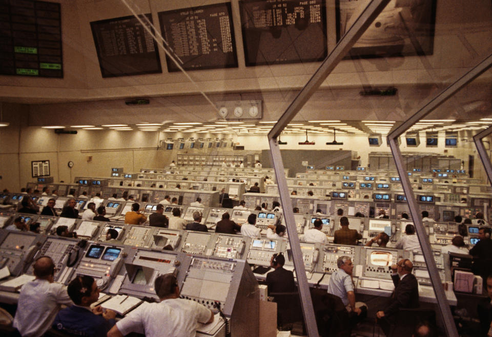 (Original Caption) Kennedy Space Center, Florida: Personnel in Firing Room 2 of the Launch Control Center monitor pre-launch activities prior to the lift off of Apollo 12 astronauts Charles Conrad, Richard Gordon, and Alan L. Bean.