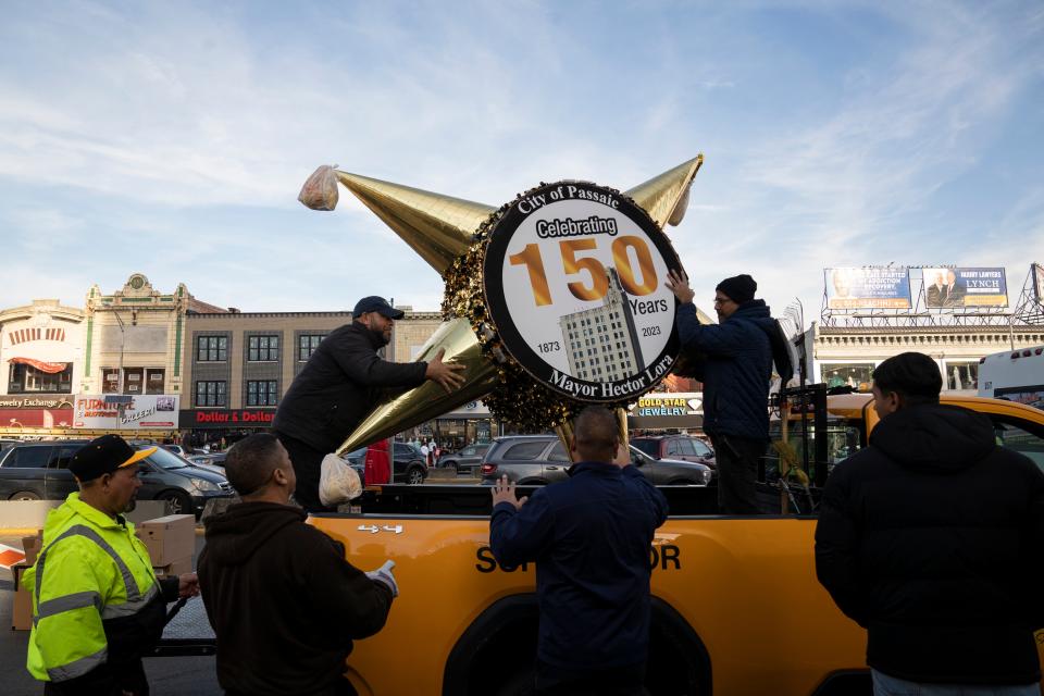 A New Year's Eve piñata is unloaded at 663 Main Avenue in Passaic before a test run on Thursday, December 29, 2022.