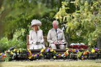 Britain's Prince Charles and Camilla, Duchess of Cornwall at the Royal British Legion Service of Commemoration at the Sumatra Railway Memorial during the national service of remembrance marking the 75th anniversary of V-J Day at the National Memorial Arboretum in Alrewas, England, Saturday Aug. 15, 2020. Following the surrender of the Nazis on May 8, 1945, V-E Day, Allied troops carried on fighting the Japanese until an armistice was declared on Aug. 15, 1945. (Anthony Devlin/PA via AP)