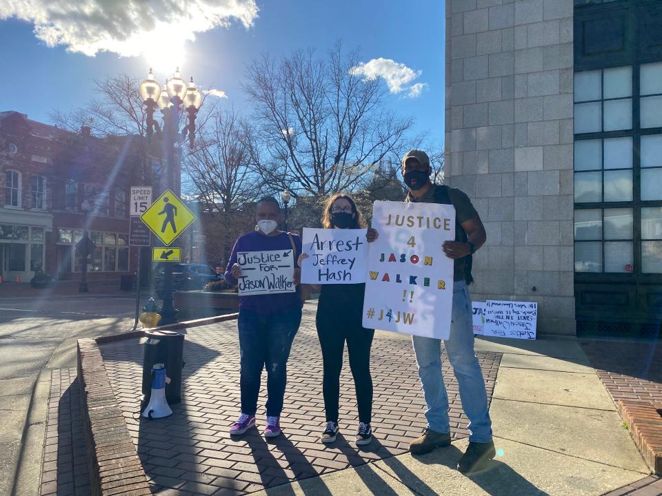 Fayetteville demonstrators Kathy Greggs, Emma Rainoff, and Shaun McMillan met Thursday, March 17, 2022 to continue demands for justice for Jason Walker.