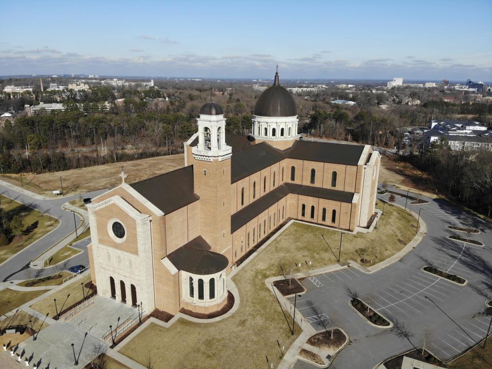 This Wednesday, Jan. 27, 2021, photo shows the Holy Name of Jesus Cathedral in Raleigh, N.C. The Raleigh Diocese collected at least $11 million from the federal government’s small business emergency relief program. Yet during the fiscal year that ended in June 2020, overall offerings were down just 5% and the assets available to the diocese, its parishes and schools increased by about $21 million to more than $170 million, AP found. In another measure of fiscal health, the diocese didn’t draw on a $10 million line of credit. (AP Photo/Allen G. Breed)