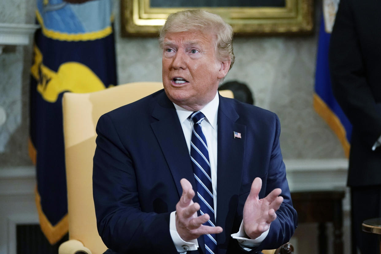 President Trump speaks to reporters in the Oval Office Thursday. (Photo by Alex Wong/Getty Images)