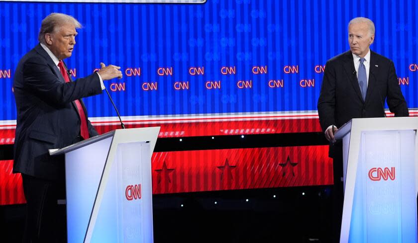 President Joe Biden, right, and Republican presidential candidate former President Donald Trump, left, participate in a presidential debate hosted by CNN, Thursday, June 27, 2024, in Atlanta. (AP Photo/Gerald Herbert)