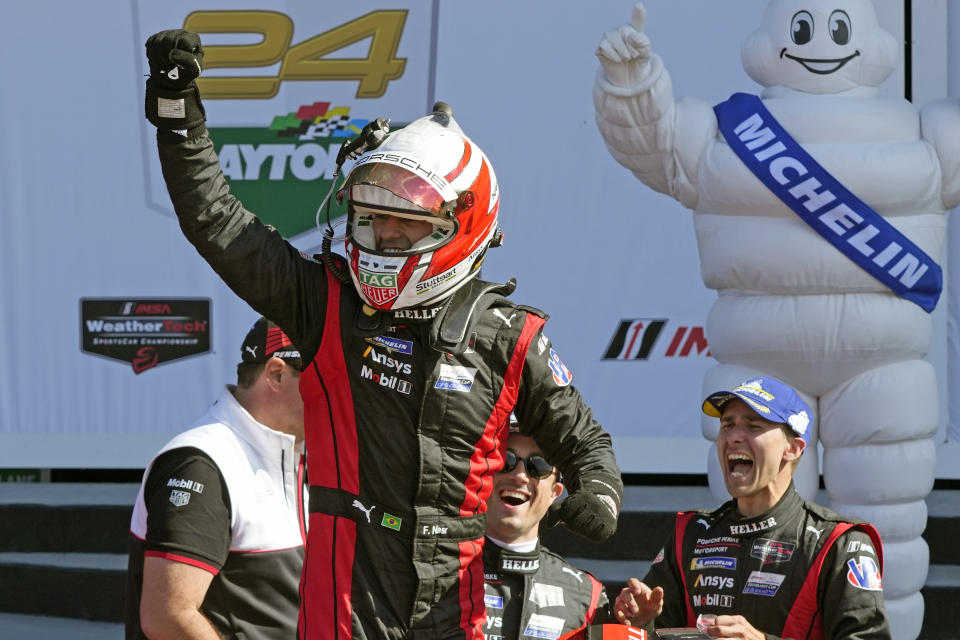 Felipe Nasr celebrates with the Porsche Penske Motorsport team in Victory Lane after winning the Rolex 24 hour auto race at Daytona International Speedway, Sunday, Jan. 28, 2024, in Daytona Beach, Fla. (AP Photo/John Raoux)