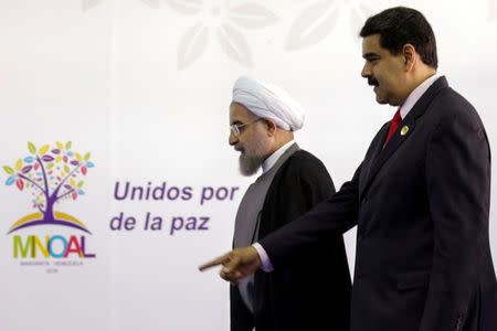 Venezuela's President Nicolas Maduro (R) welcomes Iranian President Hassan Rouhani to the 17th Non-Aligned Summit in Porlamar, Venezuela September 17, 2016. REUTERS/Marco Bello