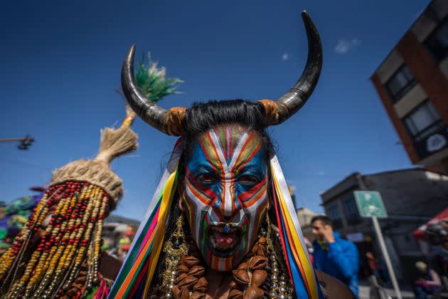 A man wearing a traditional carnival disguise and face paint takes part in the Negros y Blancos Carnival on Thursday in Pasto, Colombia. (Photo: Diego Cuevas/Getty Images)