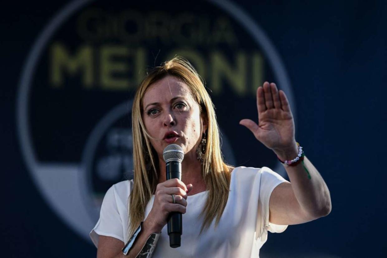 Leader of Italian far-right party Fratelli d'Italia (Brothers of Italy) Giorgia Meloni, addresses supporters during a rally as part of the campaign for general elections, in Piazza Duomo in Milan, Italy on September 11, 2022. (Photo by Piero CRUCIATTI / AFP)