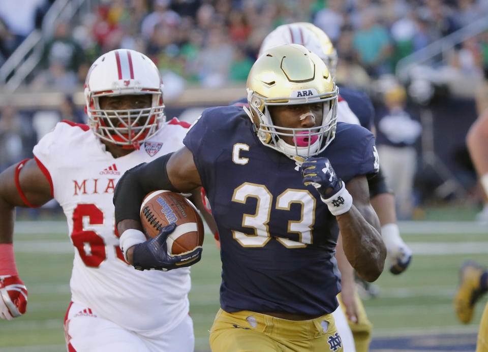 Notre Dame running back Josh Adams (33) rushed for 1,430 yards this season (AP Photo/Charles Rex Arbogast)