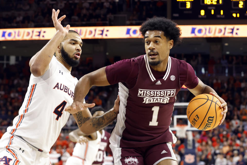 FILE - Mississippi State forward Tolu Smith (1) drives to the basket around Auburn forward Johni Broome (4) defends during the first half of an NCAA college basketball game Saturday, Jan. 14, 2023 in Auburn, Ala.. (AP Photo/Butch Dill, File)