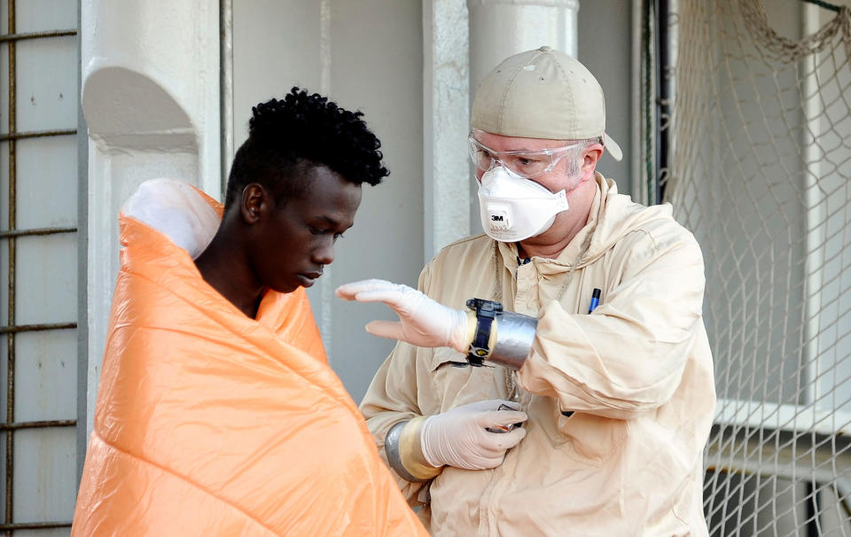 A rescued migrant disembarks in Palermo< italy