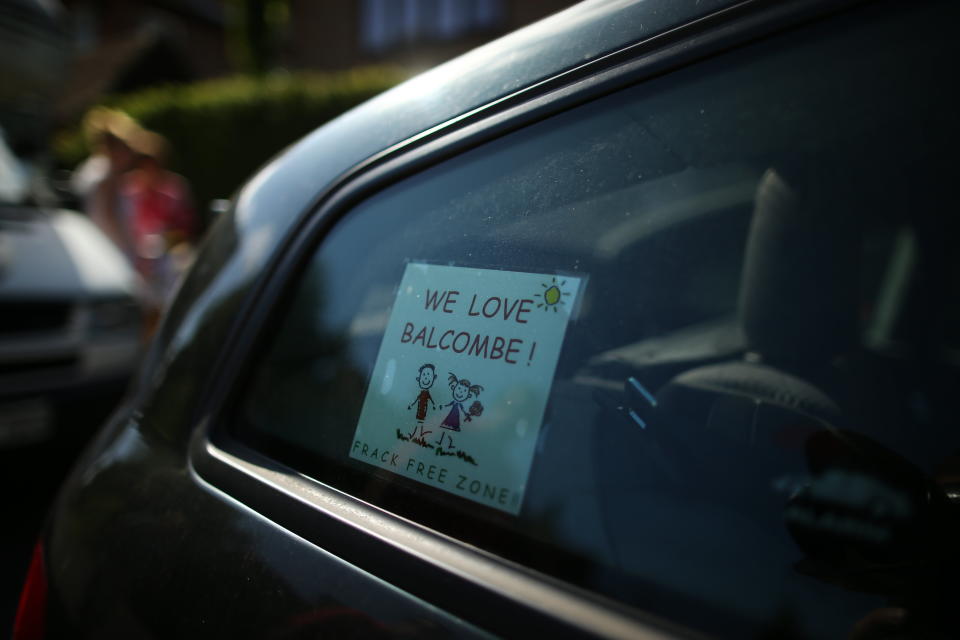 CRAWLEY, WEST SUSSEX - AUGUST 02:  A sign relating to Fracking sits in a car window in Balcombe, close to a Fracking site operated by Cuadrilla Resources Ltd on August 2, 2013 in Crawley, West Sussex. Protesters continue to gather outside the Balcombe plant in West Sussex in opposition to the controversial method of extracting energy out of the ground called 'fracking'.  (Photo by Dan Kitwood/Getty Images)