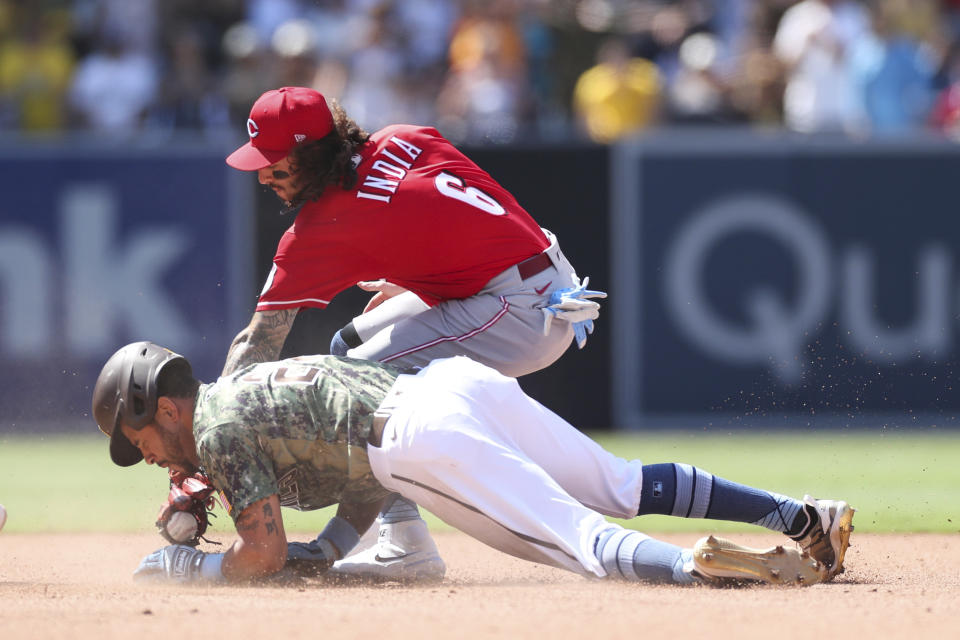 San Diego Padres' Tommy Pham slides safely into second base ahead of the tag from Cincinnati Reds second baseman Jonathan India in the seventh inning of a baseball game Sunday, June 20, 2021, in San Diego. (AP Photo/Derrick Tuskan)