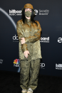 <p>Billie Eilish wore head-to-toe khaki in this co-ord combo - complete with a matching bucket hat and mask!</p>