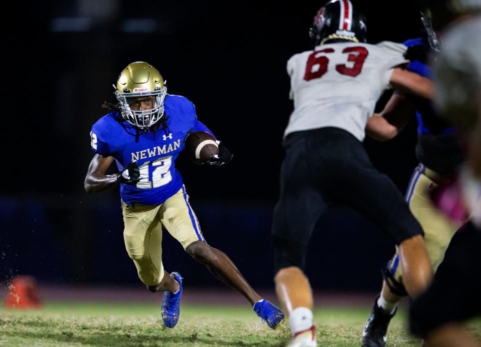 Cardinal Newman Josh Philostin runs the ball against St. Andrew's in the 3A regional playoff game in West Palm Beach, Florida on November 12, 2021.