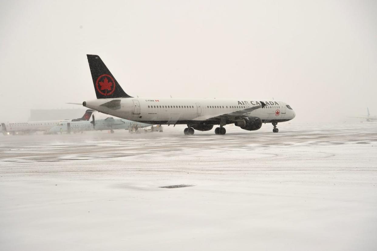 An Air Canada jet pictured at Vancouver International Airport on Wednesday. (Air Canada/Twitter - image credit)