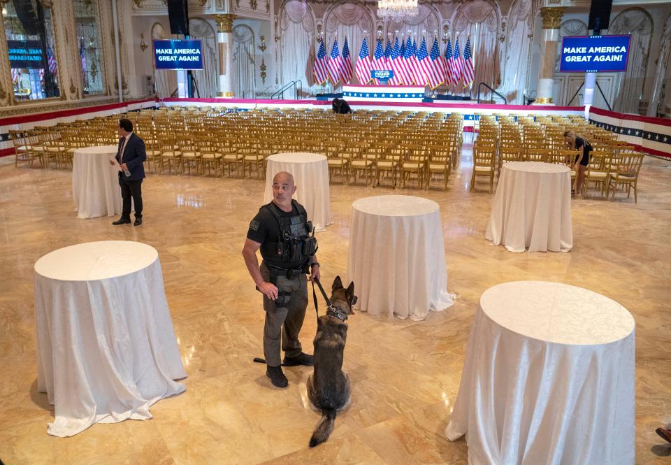 A K-9 unit stands guard before the start of a Super Tuesday watch party hosted by Donald Trump at Mar-a Lago on March 5, 2024 in Palm Beach, Florida.