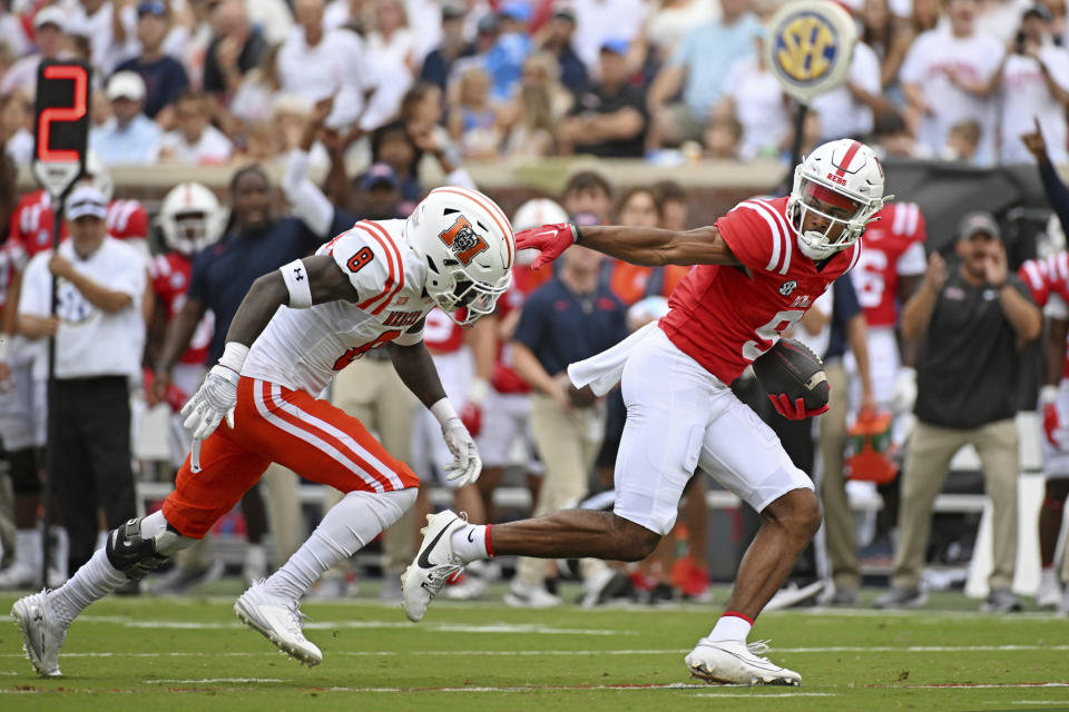 Mississippi wide receiver Tre Harris (9) breaks away from Mercer cornerback TJ Moore (8) during the first half of an NCAA college football game in Oxford, Miss., Saturday, Sept. 2, 2023. (AP Photo/Thomas Graning)