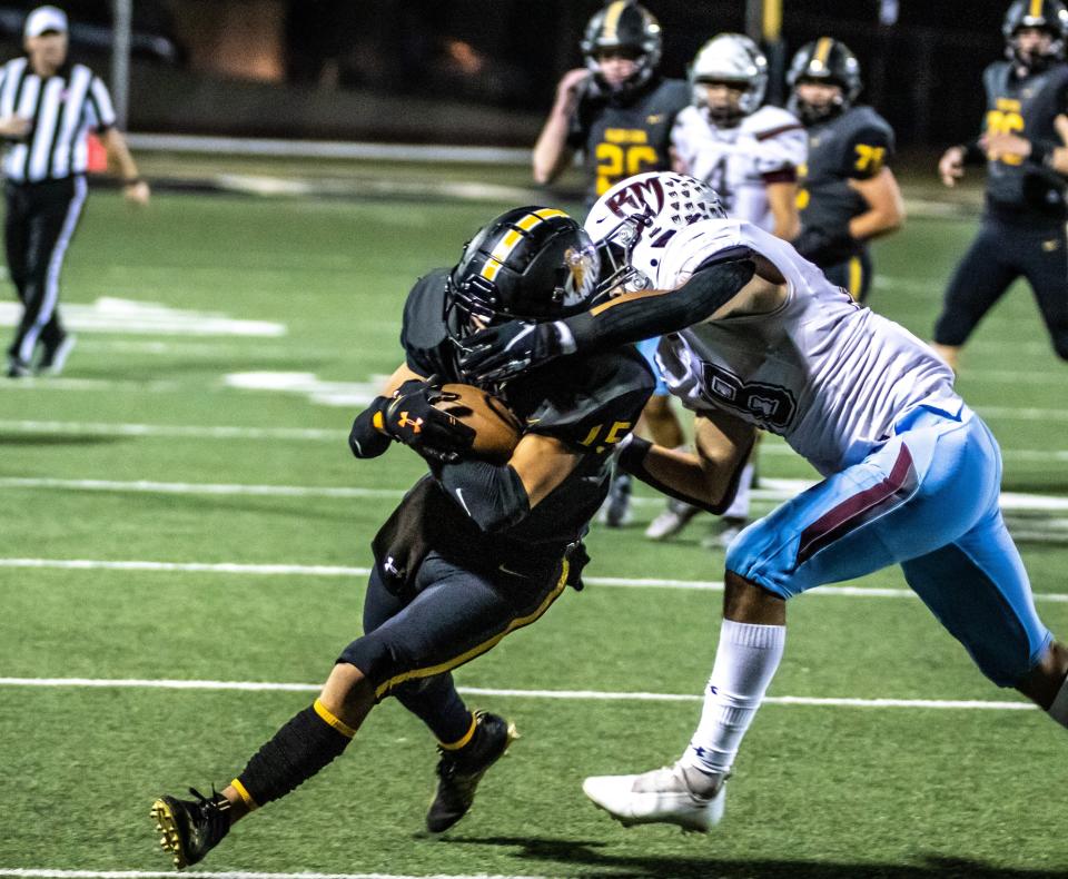 Ventura's Ayden Triana is grabbed by the facemask by a Rancho Mirage player during the Cougars' 35-19 home victory in a CIF-SS Division 9 quarterfinal on Friday, Nov. 12, 2021.