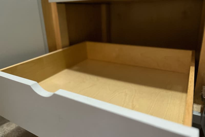 Pantry drawer open during organization project.