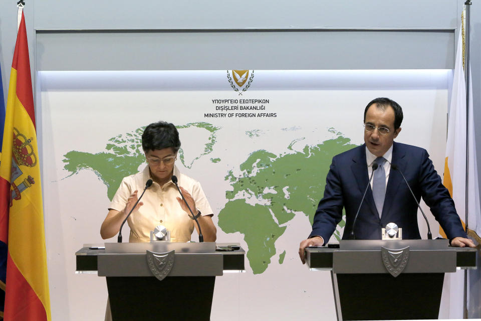 Spain's Foreign Minister Arancha Gonzalez Laya, left, talks during a news conference with her Cypriot countepart Nikos Christodoulides at the Cypriot Foreign Ministry building in the capital Nicosia, Cyprus, on Wednesday, Sept. 30, 2020. Laya said her visit aimed to convey her country's solidarity with Cyprus amid tensions over a Turkish gas search in waters were Cyprus claims exclusive economic rights. (AP Photo/Petros Karadjias)