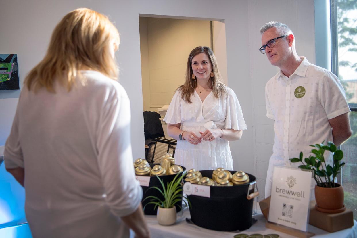 Brewwell owners Shannon and Josh talk about their beer at an event in Asheville, August 19, 2023.