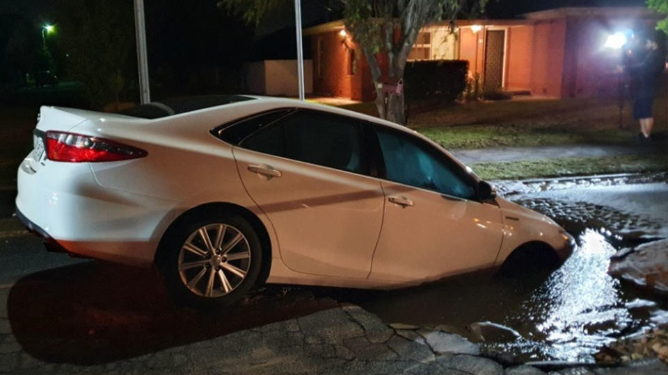 The Toyota Camry in the sink hole.