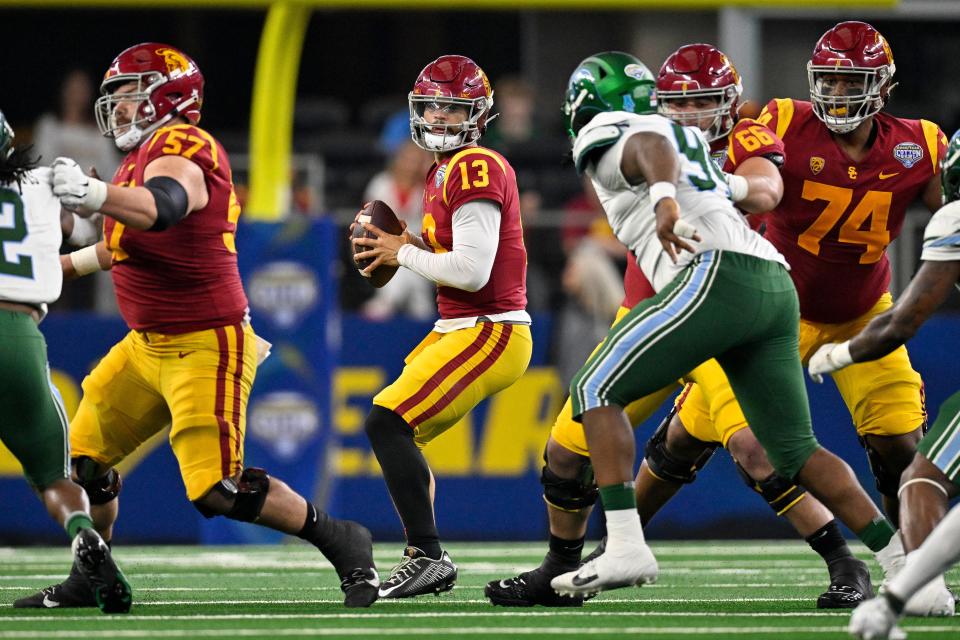 Southern California quarterback Caleb Williams (13) looks to throw against Tulane during the 2023 Cotton Bowl at AT&T Stadium.