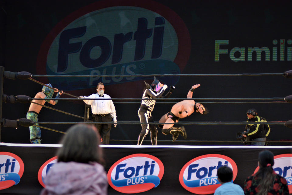 MEXICO CITY, MEXICO - MARCH 20:  Mexican wrestlers fight during wrestling night of the Mexican Lucha Libre at Autocinema Coyote on March 20, 2021 in Mexico City, Mexico. (Photo by Medios y Media/Getty Images)