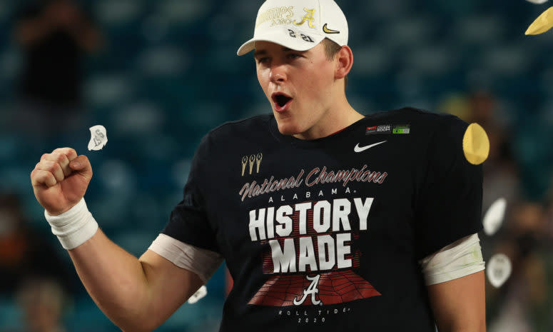 Mac Jones #10 of the Alabama Crimson Tide celebrates after winning the national championship. He's a New England Patriots rookie in 2021.