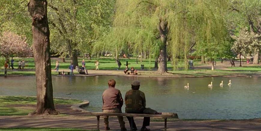 Two men sit on a bench