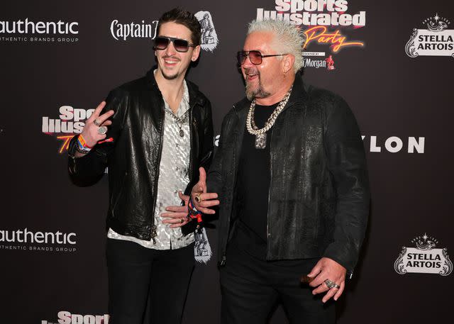 <p>Ethan Miller/Getty</p> Hunter Fieri and Guy Fieri attend the 2023 Sports Illustrated Super Bowl Party in February 2023.
