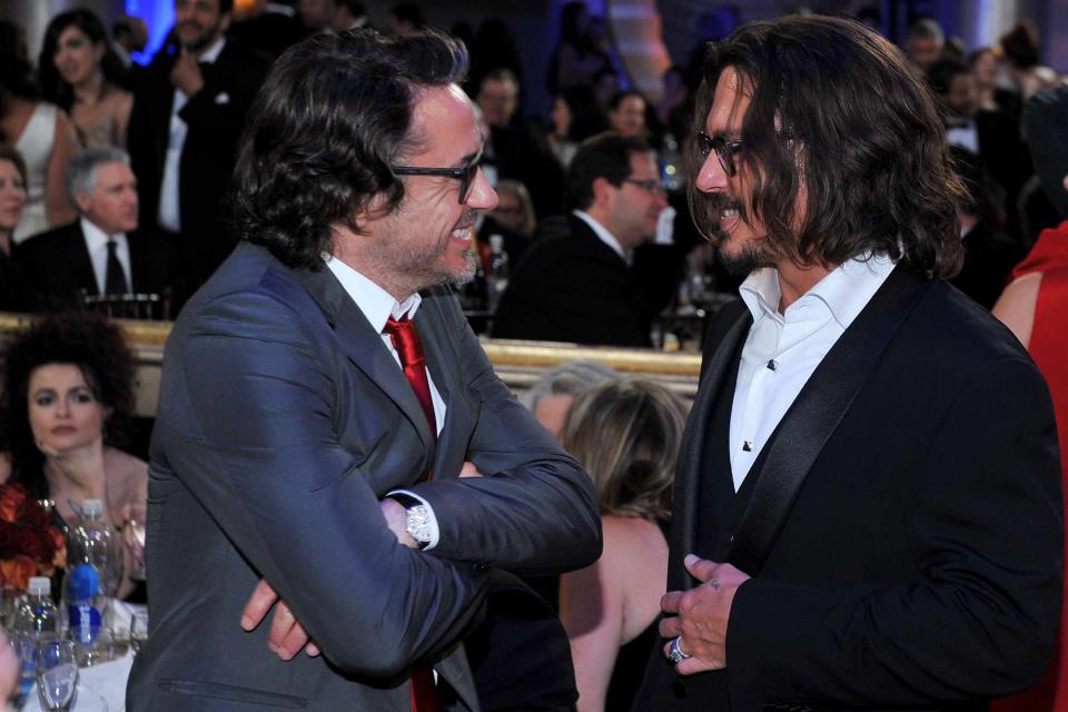 <p> Vince Bucci/NBCU Photo Bank/NBCUniversal via Getty </p> Robert Downey Jr. and Johnny Depp on Jan. 16, 2011