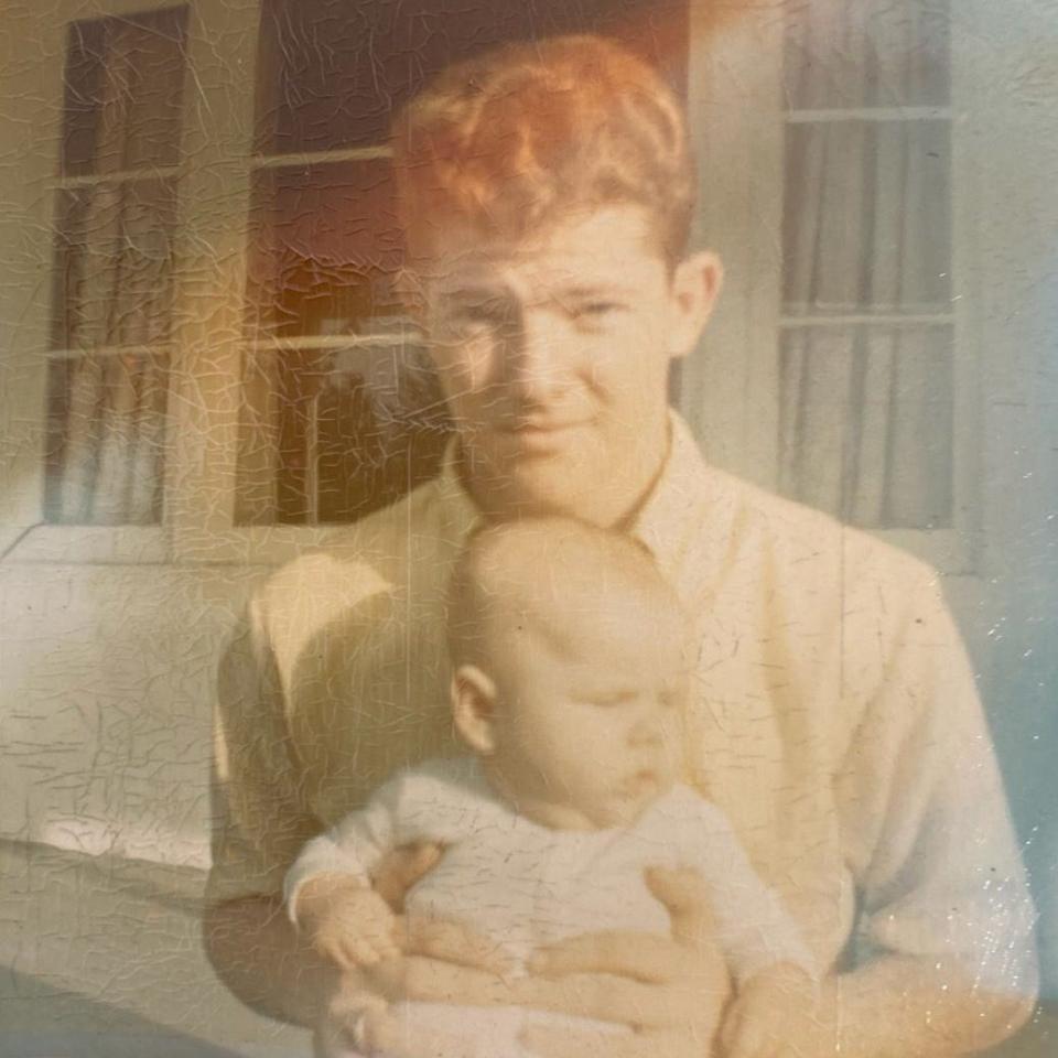 Clarence Lynn Wilson holding his nephew.