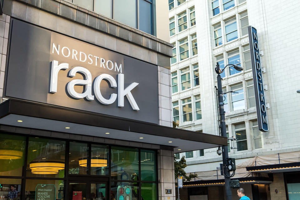 The entrance to a Nordstrom Rack store, with a full-line Nordstrom store in the background