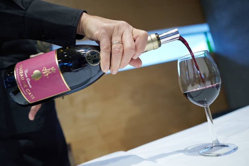 Red wine is served during a ceremony. France's winegrowers are facing declining sales at home and abroad compounded by falling producer prices, despite achieving an above-average grape harvest last year. Jörg Carstensen/dpa