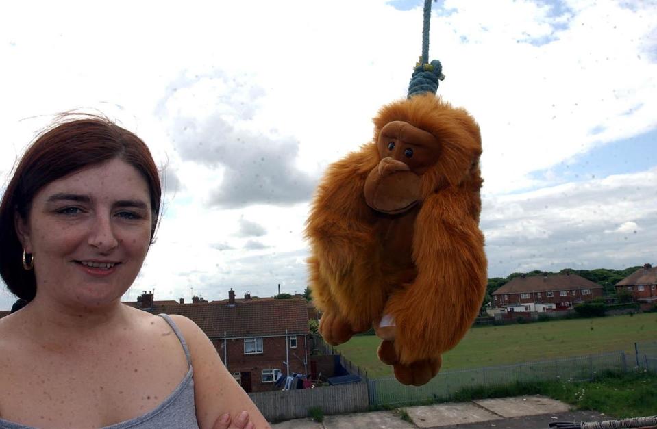 Landlady Trina Dixon with a hanging monkey in 2003. (Photo: FLR)