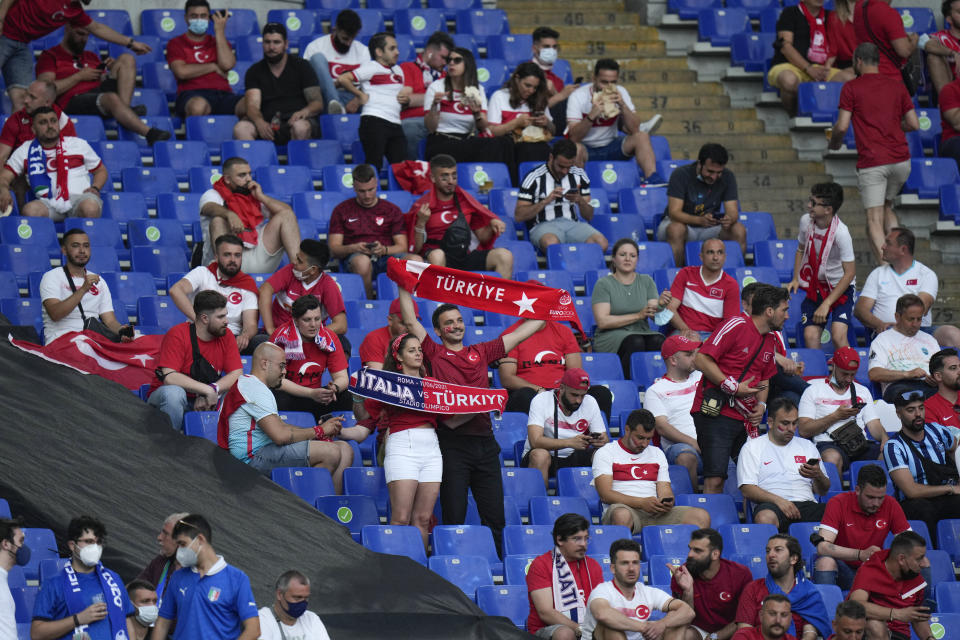 Turkish fans wait for the kick-off of the Euro 2020, group A soccer match between Italy and Turkey, at the Rome Olympic stadium, Friday, June 11, 2021. (AP Photo/Alessandra Tarantino, Pool)