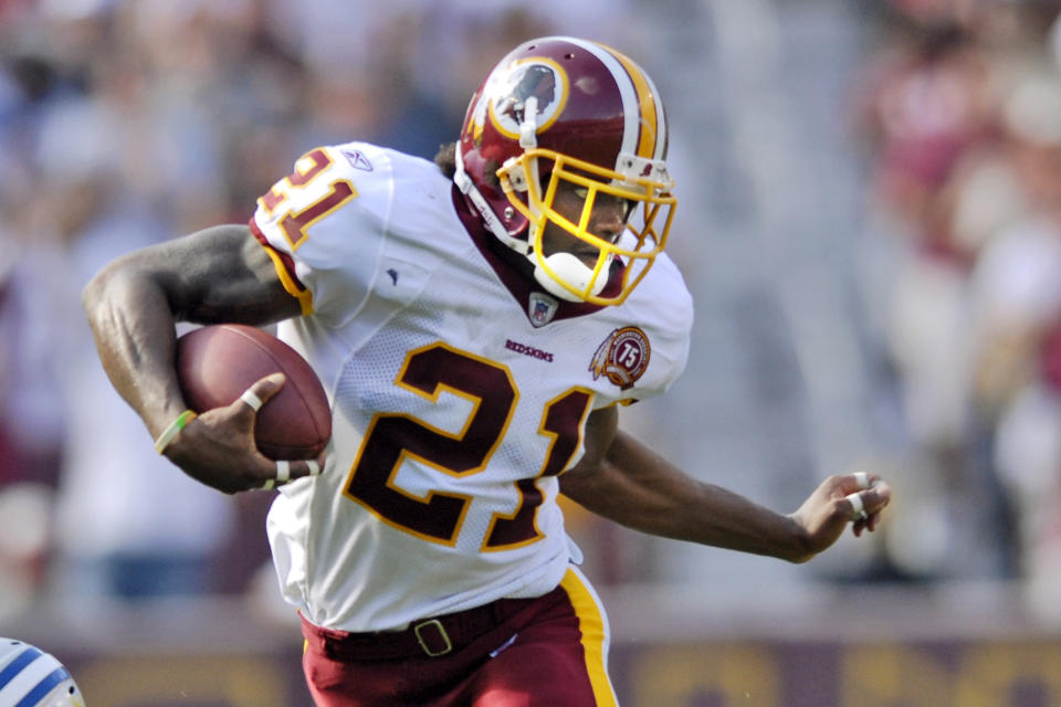 FILE - In this Oct. 7, 2007, file photo, Washington Redskins safety Sean Taylor carries the ball during an NFL football game against the Detroit Lions in Landover, Md. The Washington Football Team plans to retire late safety Sean Taylor's number before its upcoming game against Kansas City. (AP Photo/Nick Wass, File)