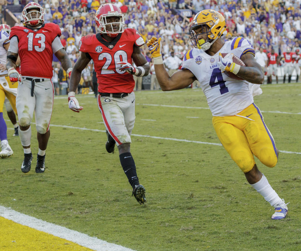 LSU running back Nick Brossette (4) scores a touchdown against Georgia during the second half of an NCAA college football game in Baton Rouge, La., Saturday, Oct. 13, 2018. (AP Photo/Matthew Hinton)