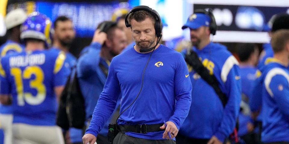 Sean McVay looks down while walking the sideline during a Rams game.