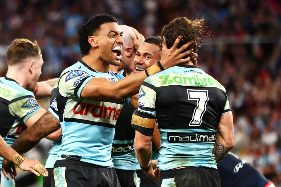 BRISBANE, AUSTRALIA - MAY 18: Ronaldo Mulitalo and Nicho Hynes of the Sharks celebrate a try during the round 11 NRL match between Cronulla Sharks and Sydney Roosters at Suncorp Stadium, on May 18, 2024, in Brisbane, Australia. (Photo by Chris Hyde/Getty Images)