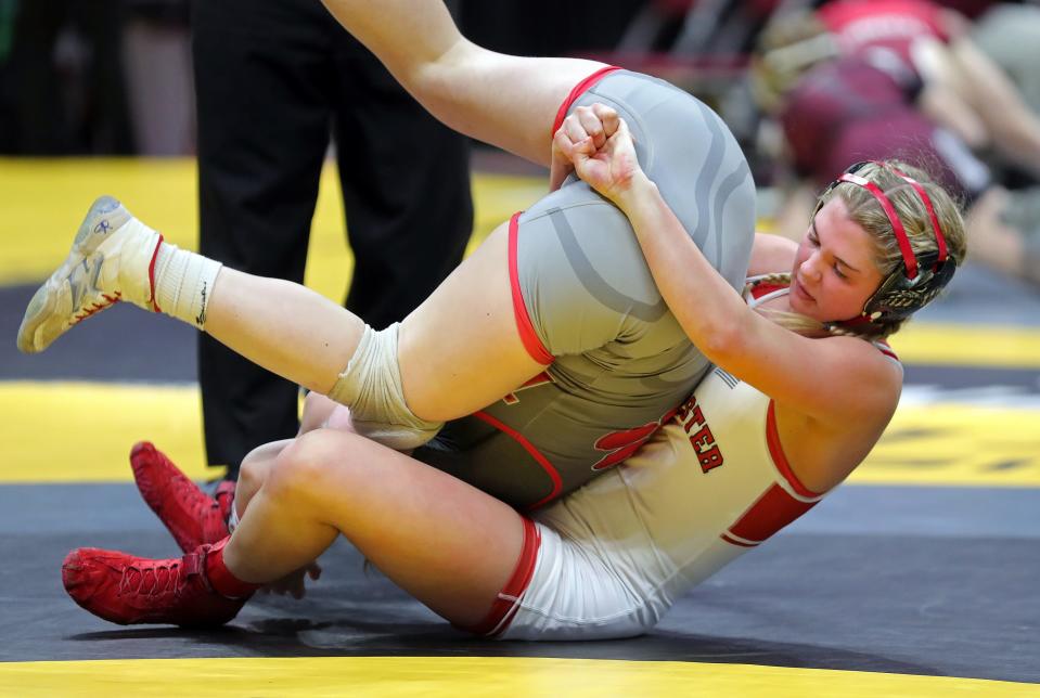 Jaydyn McKinney of Manchester, right, rolls over Kaylee Toner of glouster Trimble during their 135-pound match in the OHSAA State Wrestling Tournament at the Jerome Schottenstein Center, Friday, March 10, 2023, in Columbus, Ohio.