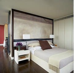 Try using cool colors in your artwork, too. Here, the need for a headboard is negated by thisâ€¦