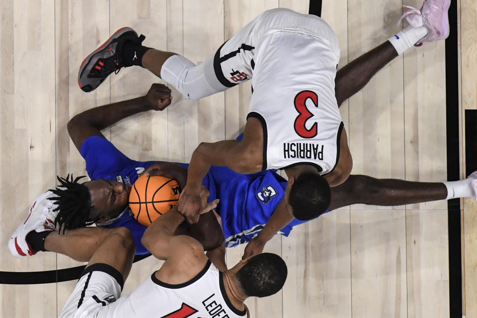 Creighton forward Arthur Kaluma (24) vies for a loose ball against San Diego State guard Micah Parrish (3) in the first half of a Elite 8 college basketball game in the South Regional of the NCAA Tournament, Sunday, March 26, 2023, in Louisville, Ky. (AP Photo/Timothy D. Easley)