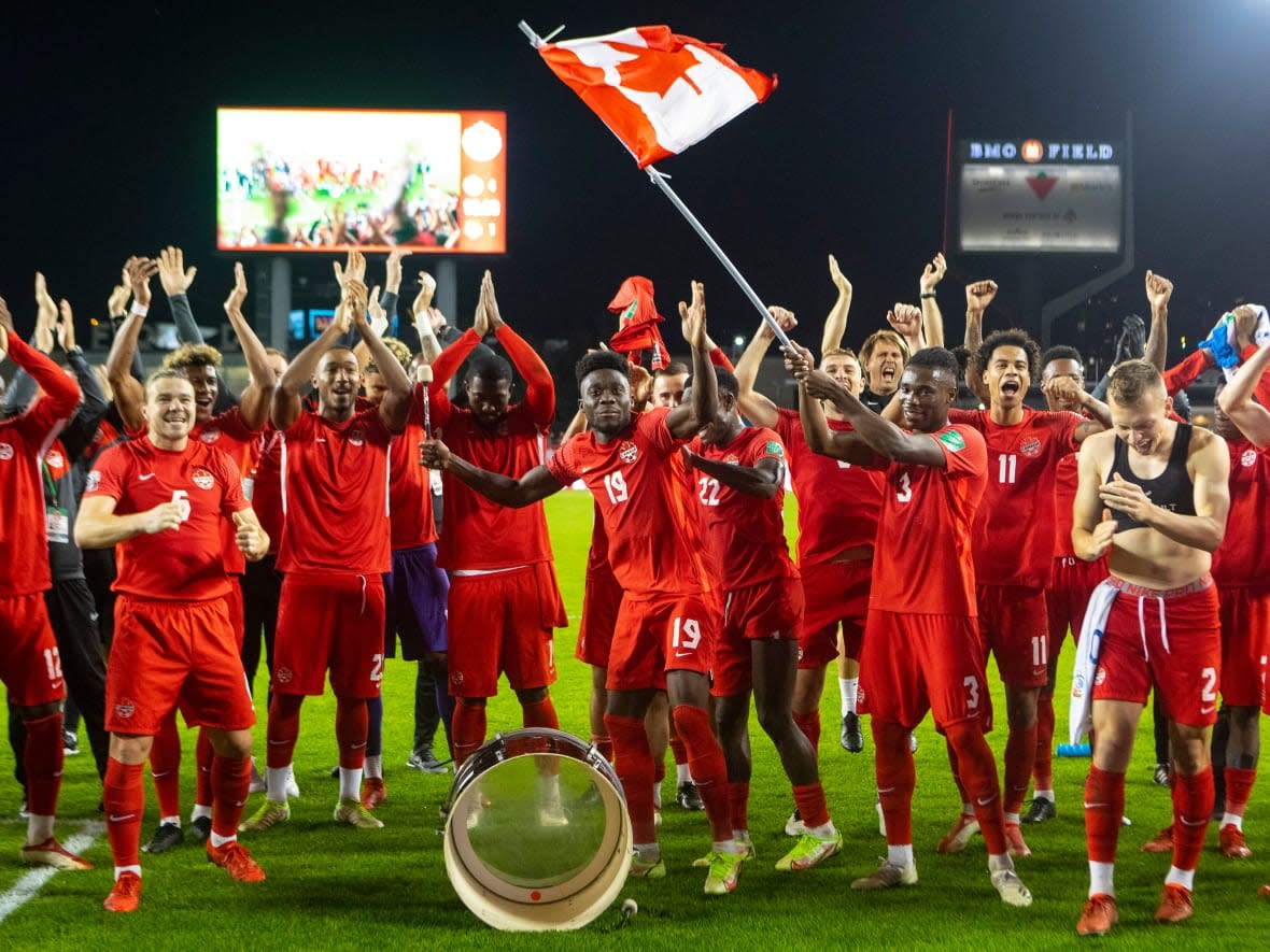 Alphonso Davies, centre, leads Canada's team in a victory celebration following a 4-1 win over Panama on Wednesday in Toronto. (Chris Young/The Canadian Press - image credit)