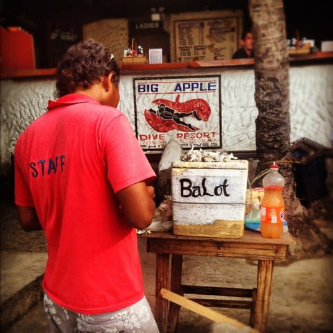 A street food vendor selling balut - Credit: GETTY