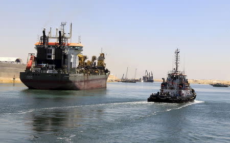 A cargo ship is seen crossing through the New Suez Canal, Ismailia, Egypt, July 29, 2015. REUTERS/Mohamed Abd El Ghany